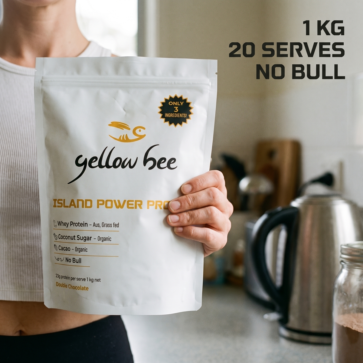 Person holding the 1kg Island Power Protein bag in a kitchen, 20 serves of Australian grass-fed chocolate whey